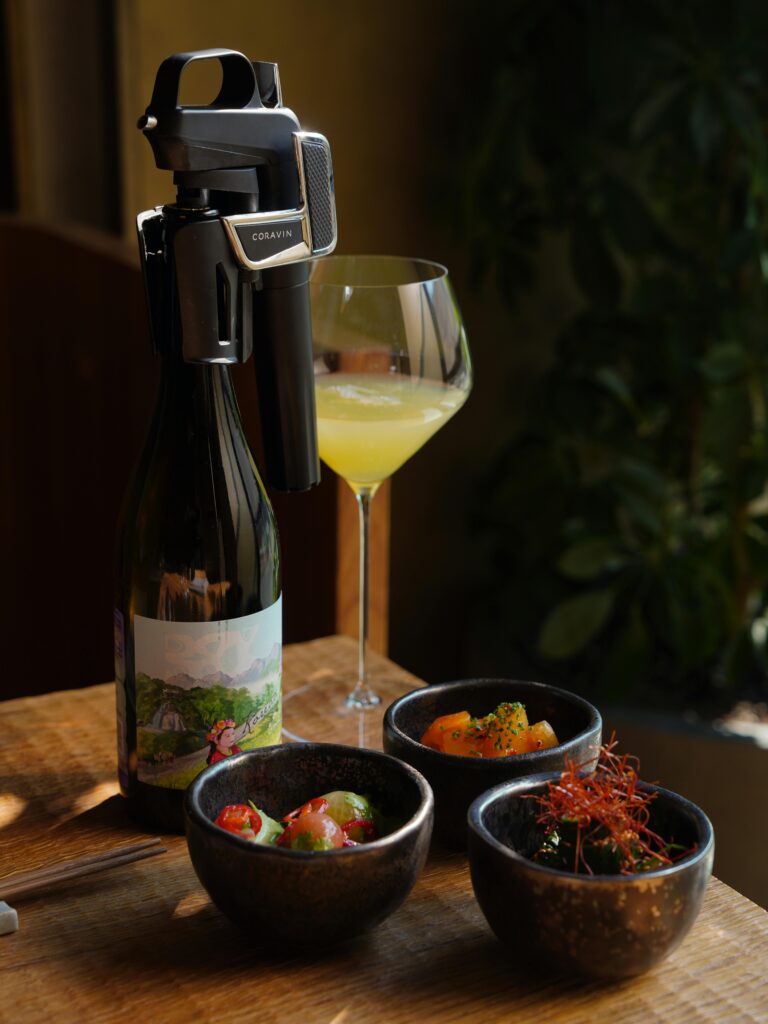 Stylish wine setup with gourmet appetizers on a wooden table, offering a taste of luxury and elegance.