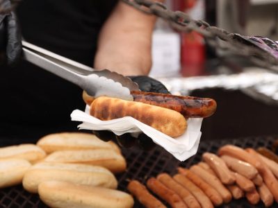 pexels-photo-24863016-24863016 Close-up of grilled sausages being served at a street food stand in Jönköping, Sweden.